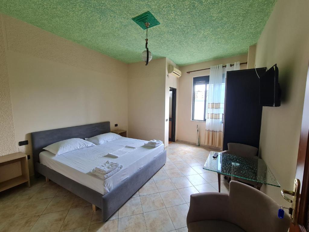Postel nebo postele na pokoji v ubytování Hotel La Villa
