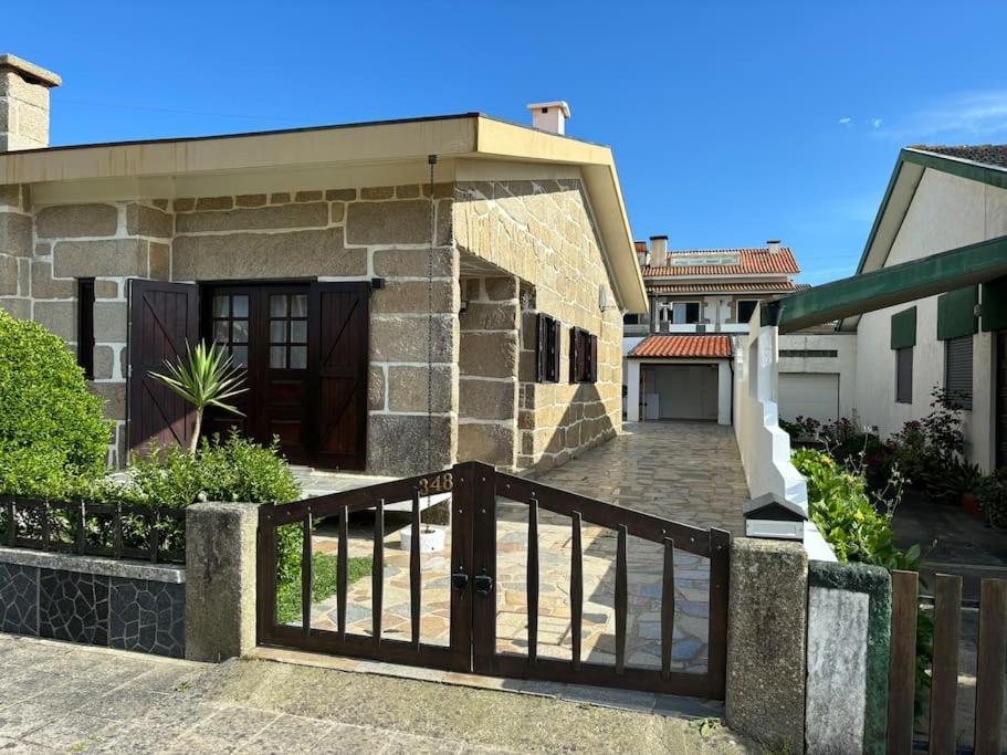 a house with a wooden gate in front of it at Mindelo's Residence in Mindelo