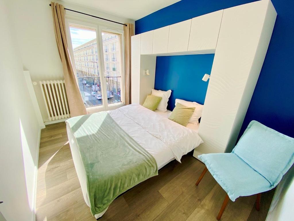 Кровать или кровати в номере L'Escale Appartements et Suites en bord de Mer