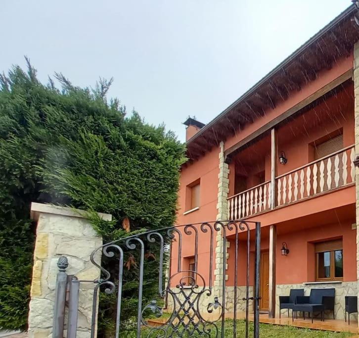 a building with a gate in front of it at Abuela Carmen in Riaño