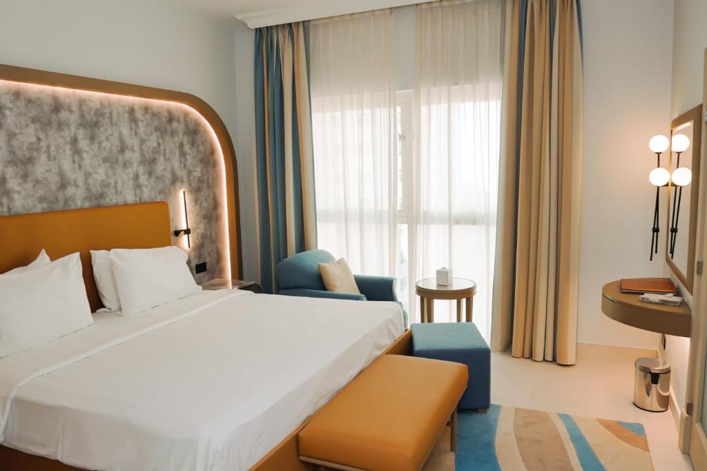 Cama o camas de una habitación en Sheraton Khalidiya Hotel
