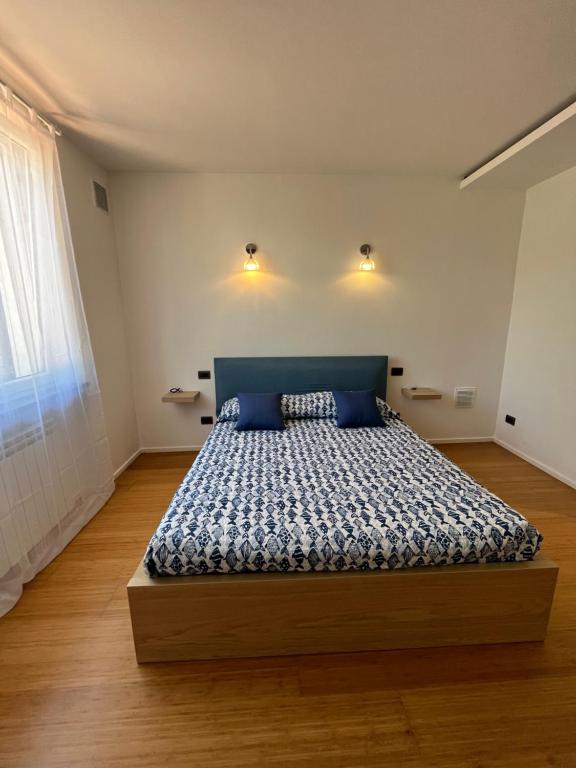 Ένα ή περισσότερα κρεβάτια σε δωμάτιο στο Villetta Bianca