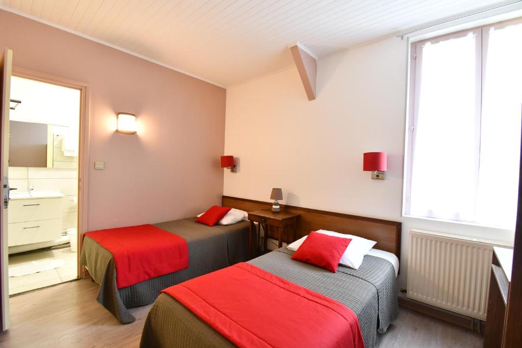 Postel nebo postele na pokoji v ubytování Hotel Fortin