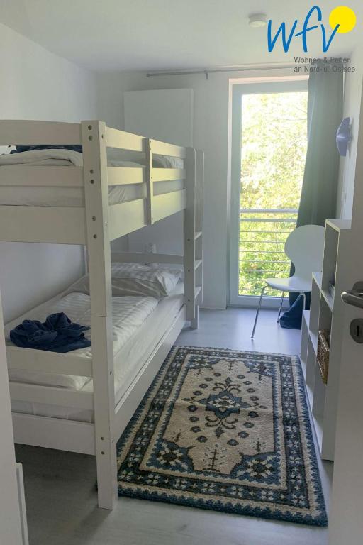 Postel nebo postele na pokoji v ubytování Villa Düna Ferienwohnung 3