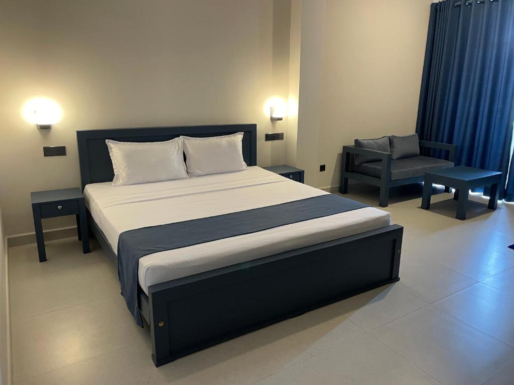 Postel nebo postele na pokoji v ubytování Grand Ben Hotel