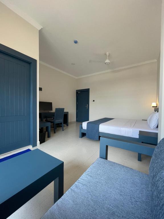 Postel nebo postele na pokoji v ubytování Grand Ben Hotel