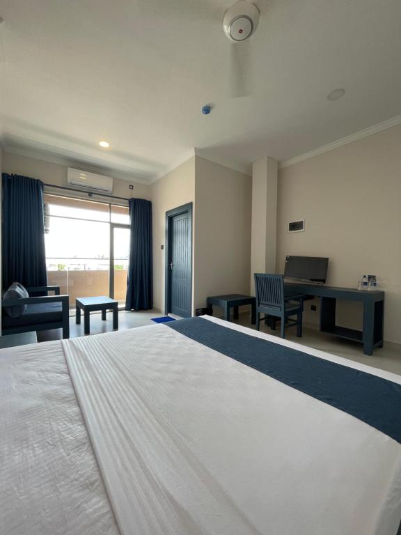 Postel nebo postele na pokoji v ubytování Grand Ben Hotel