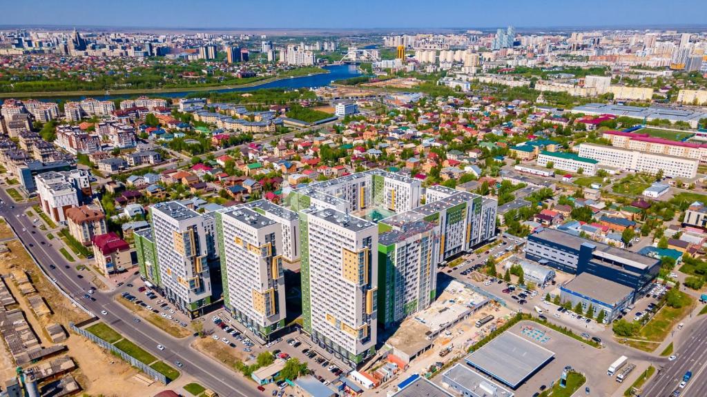 an aerial view of a city with tall buildings at Набережная, небоскребы, кофейня, фитнес, стильно и недорого, ЖК 7Я in Astana