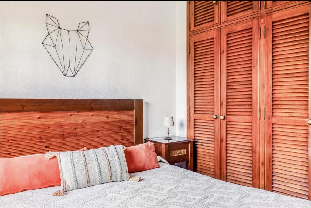 Postel nebo postele na pokoji v ubytování Casa da Falésia