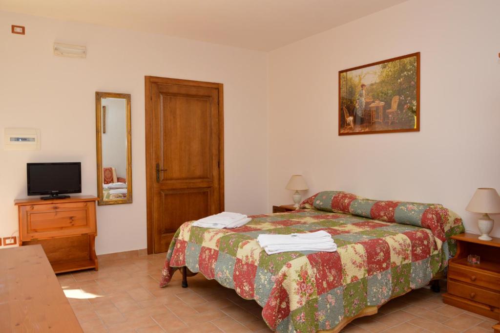 Łóżko lub łóżka w pokoju w obiekcie Agriturismo "La Fraschetta"