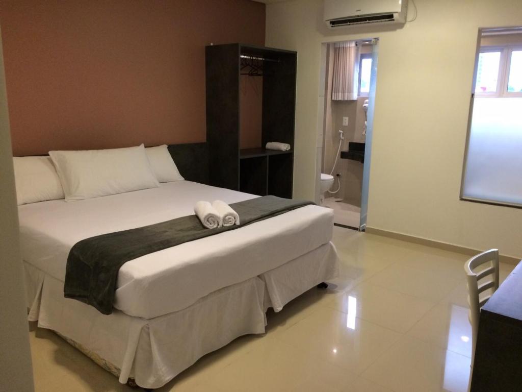 Cama ou camas em um quarto em Scenarium Hotel