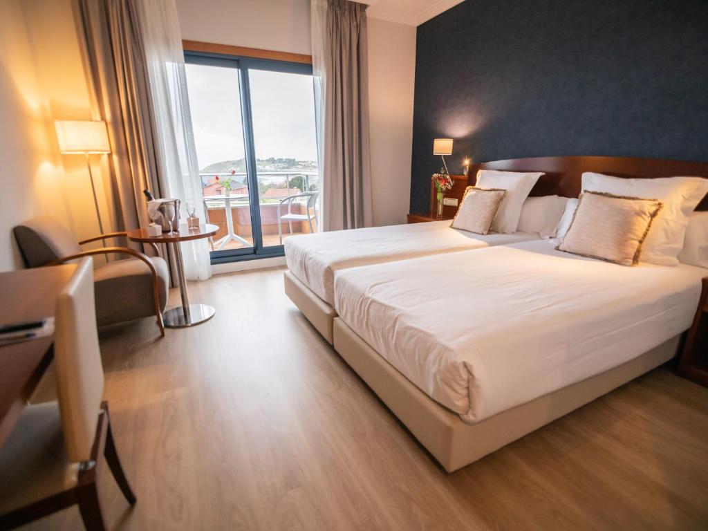Кровать или кровати в номере Hotel Spa Galatea