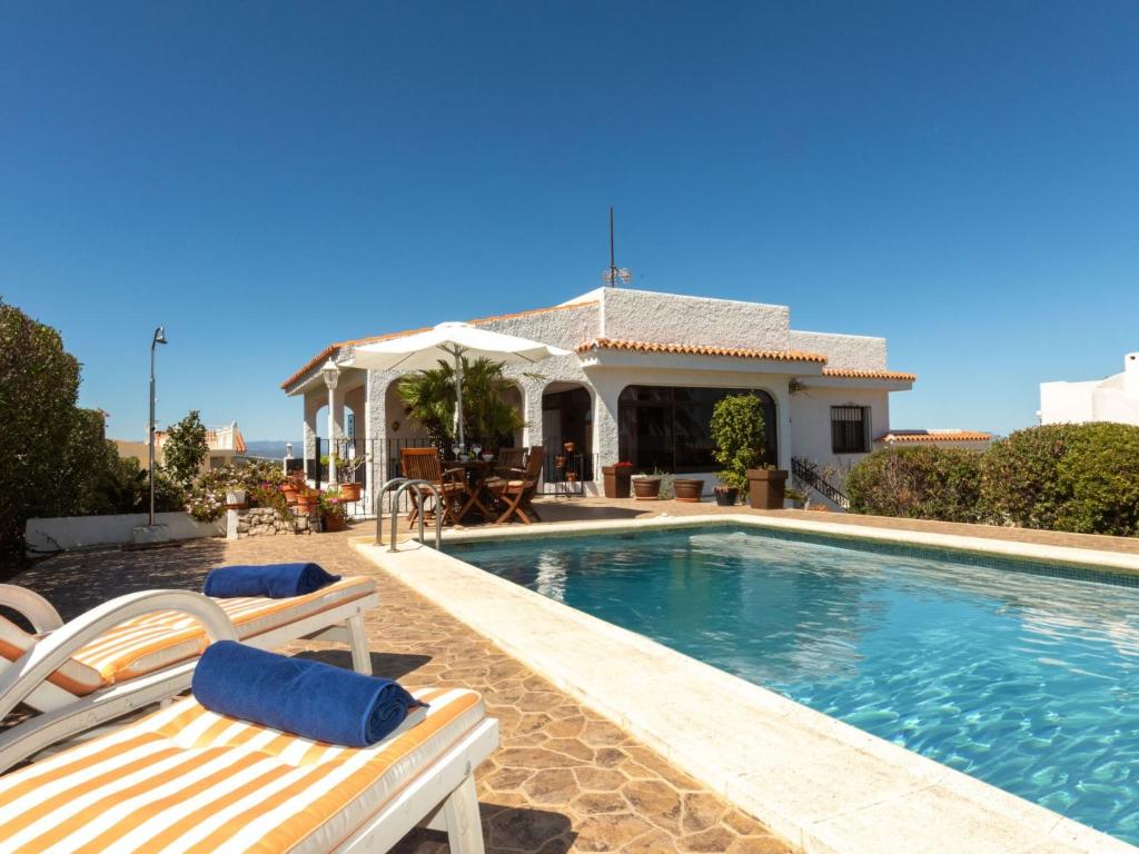a villa with a swimming pool and a house at Holiday Home Villa Paloma by Interhome in Peñíscola