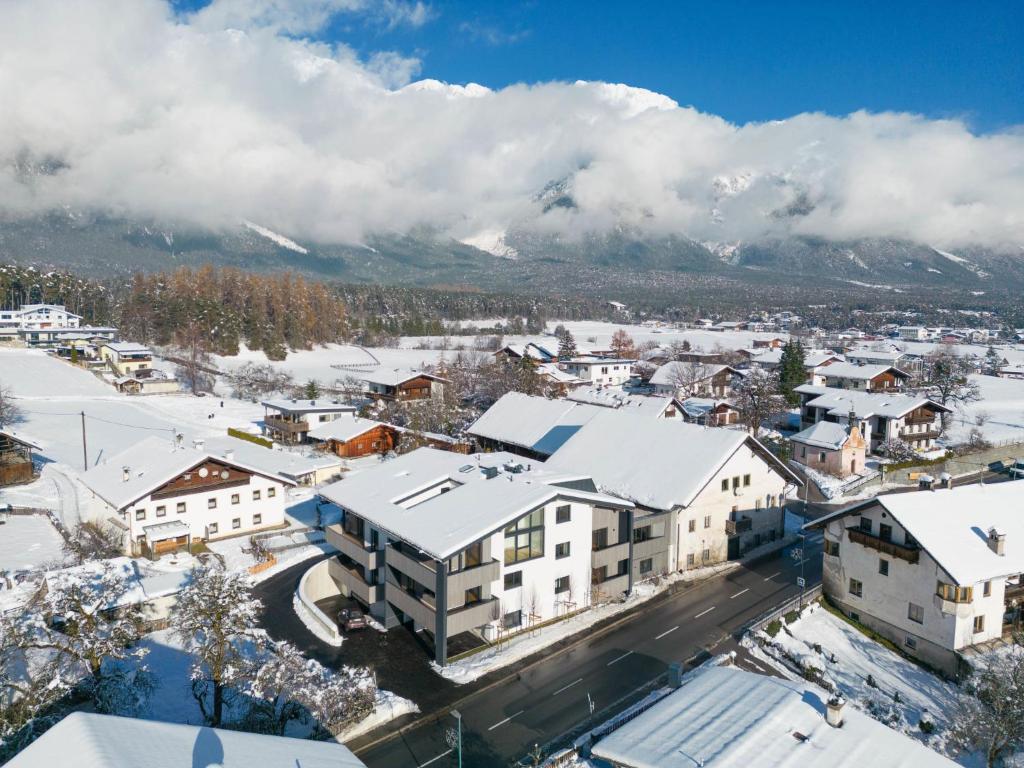 an aerial view of a small town with snow covered buildings at Apartment be magic by Interhome in Mieming