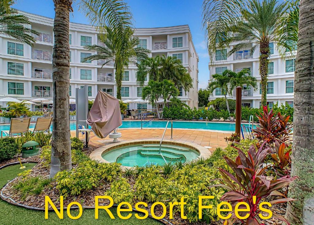 a resort with a pool and palm trees and text no resort fees at 1Bed/1Bath Pet Friendly Condo at the Melia in Orlando