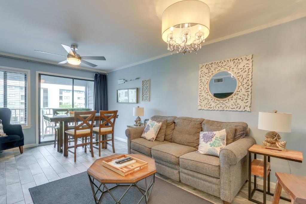 a living room with a couch and a table at Walk to Beach Hilton Head Resort Condo with Pools! in Hilton Head Island