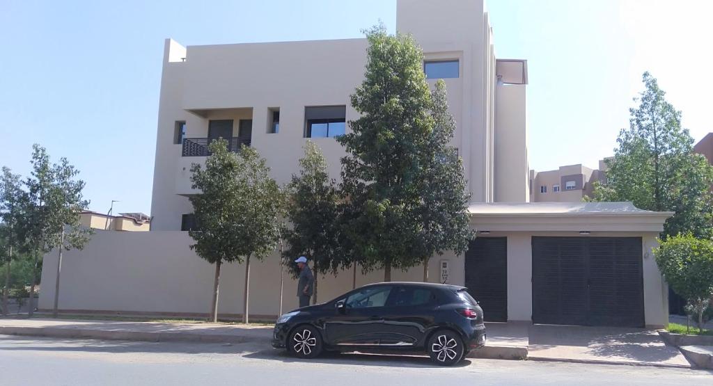 a black car parked in front of a building at Marrakech villa in Marrakech