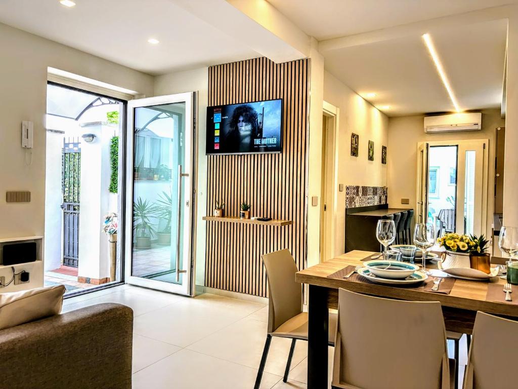 a kitchen and dining room with a table and chairs at - La Grotta del Mare- Beach and Apuan Alps- in Marina di Carrara
