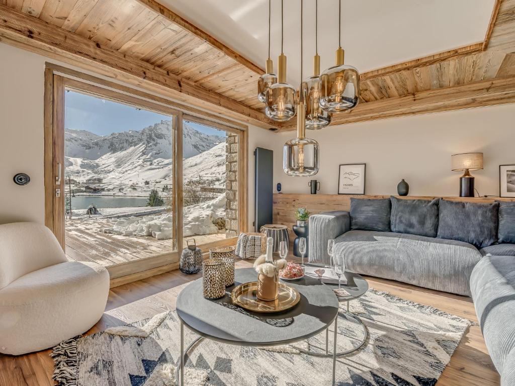 a living room with a couch and a table at Apartment Le Canvolan-1 by Interhome in Tignes