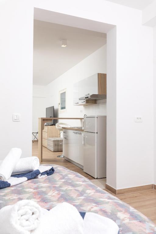 Postel nebo postele na pokoji v ubytování Stella Mare Eco Boutique House
