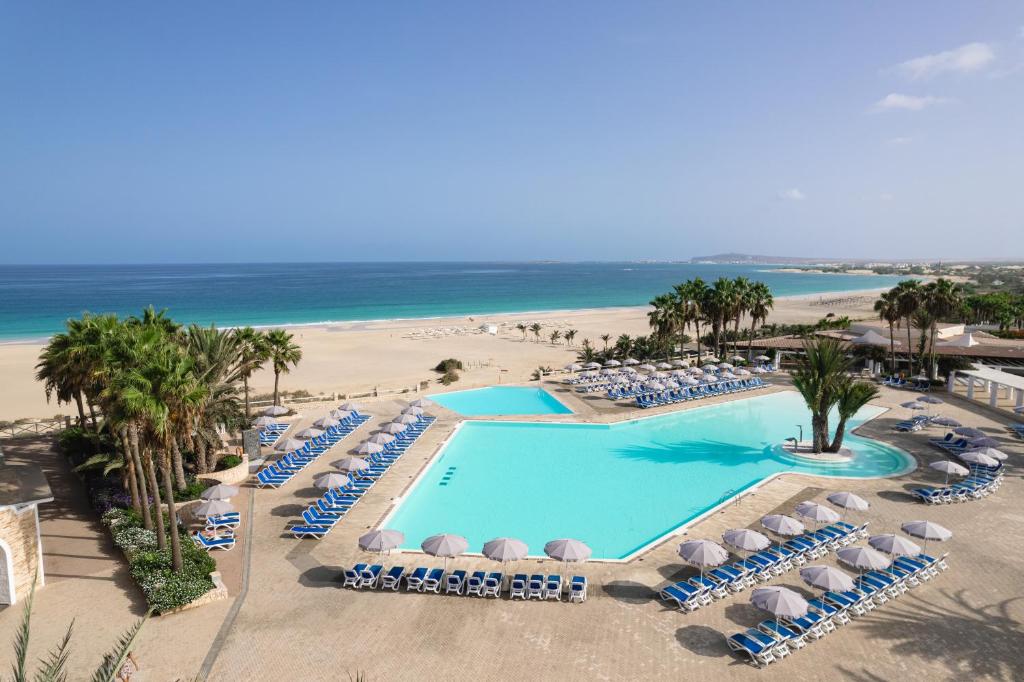 an aerial view of a resort swimming pool and the beach at VOI Praia de Chaves Resort in Sal Rei