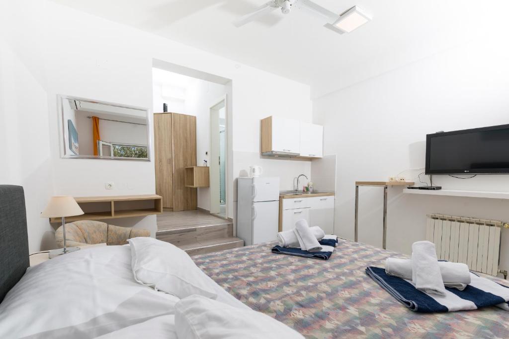 Postel nebo postele na pokoji v ubytování Stella Mare Eco Boutique House