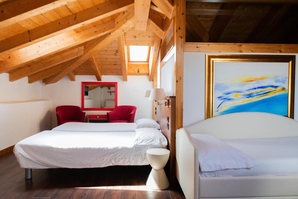 Postel nebo postele na pokoji v ubytování Arciduca Charming House Room & Breakfast