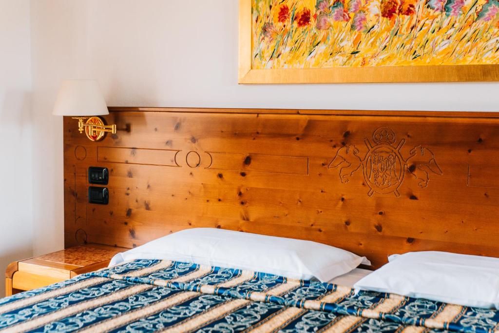 Postel nebo postele na pokoji v ubytování Arciduca Charming House Room & Breakfast