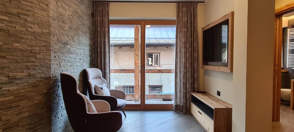 TV a/nebo společenská místnost v ubytování Appartamenti Home Service