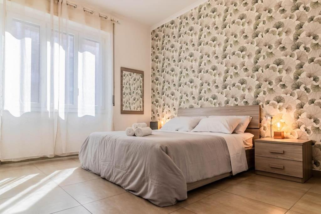 a bedroom with a bed and a wall with teddy bears at [20 minuti dal Duomo] Milano Smart Apartment in Sesto San Giovanni