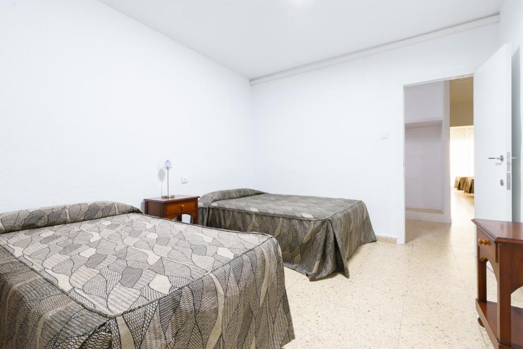 Postel nebo postele na pokoji v ubytování Apartamentos Maja