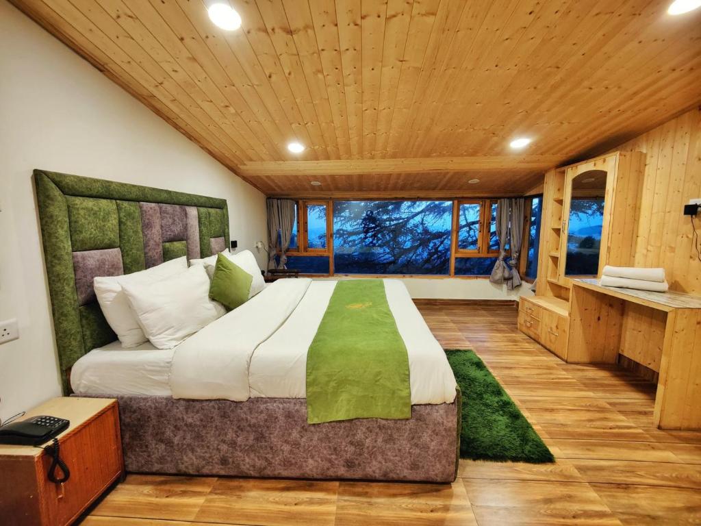 Postel nebo postele na pokoji v ubytování Jakhu Vibes