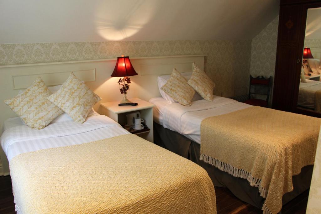 Postel nebo postele na pokoji v ubytování Innisfree House