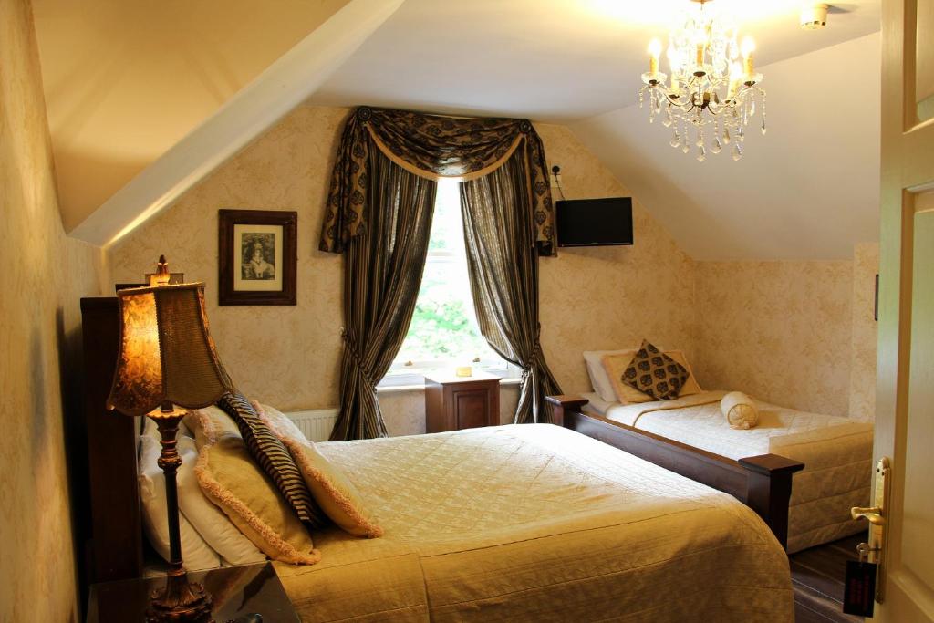 Postel nebo postele na pokoji v ubytování Innisfree House
