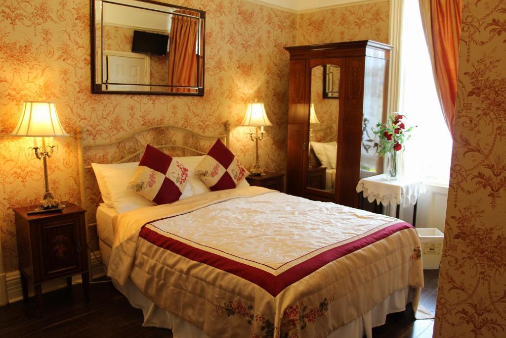Postel nebo postele na pokoji v ubytování Innisfree House