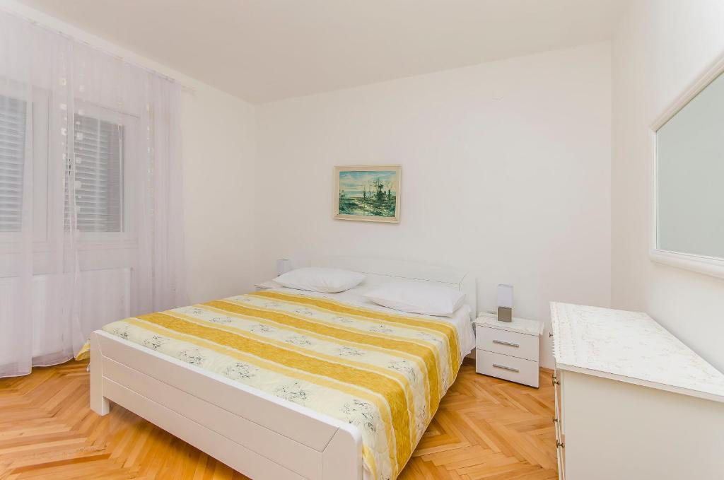 Postel nebo postele na pokoji v ubytování Apartment Sime
