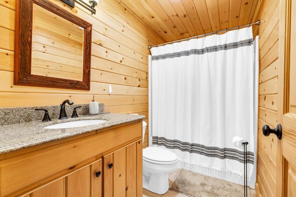 a bathroom with a shower and a toilet and a sink at Chalet*Mountain Views*3-mins Sunday River*Hot Tub in Newry