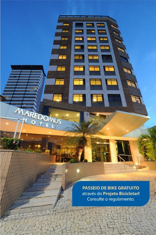 a building with a sign in front of it at Maredomus Hotel in Fortaleza