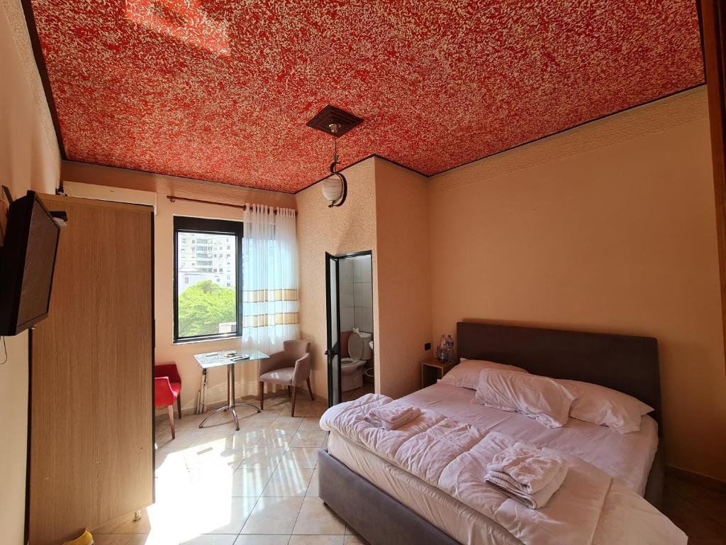 Postel nebo postele na pokoji v ubytování Hotel La Villa
