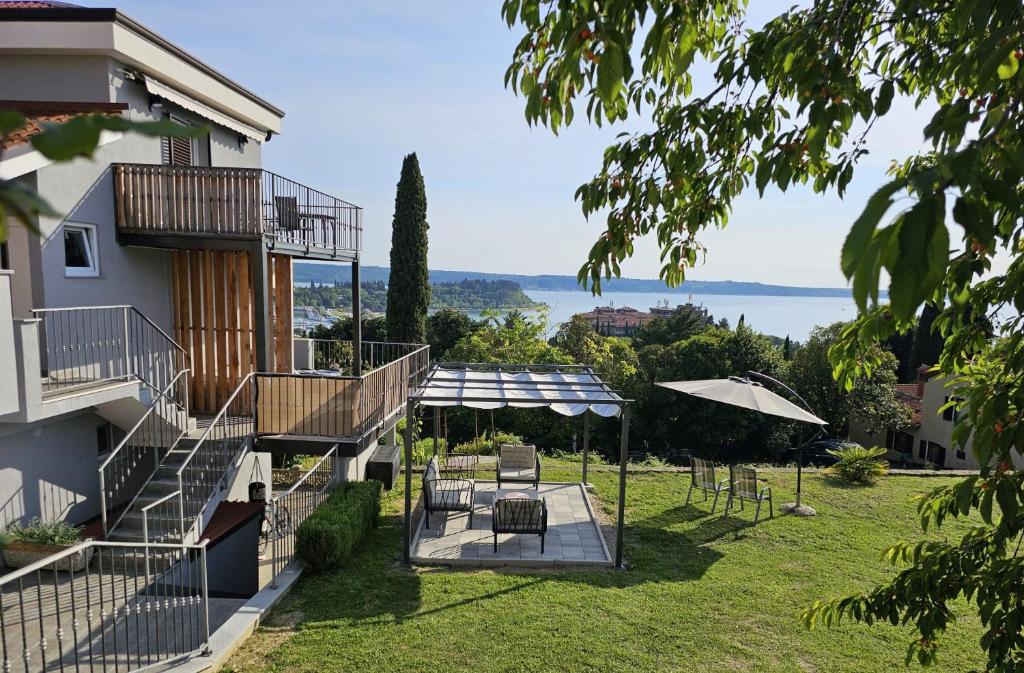 a view of the house from the garden at Roma in Portorož