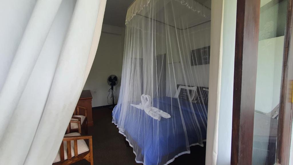 Postel nebo postele na pokoji v ubytování Villa Emerald Ella