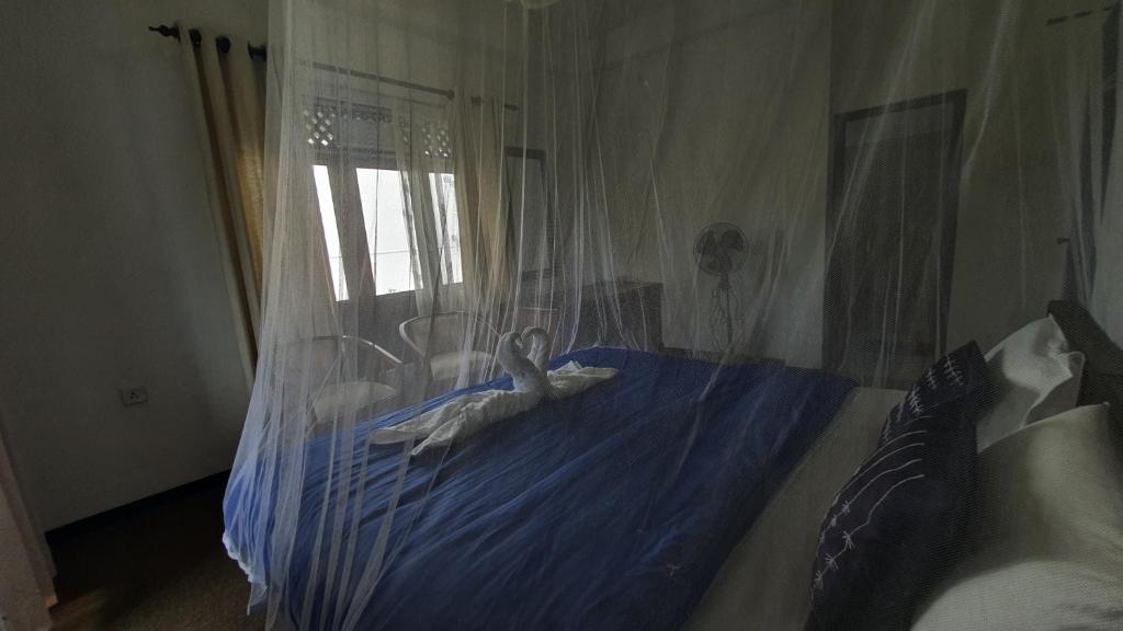 Postel nebo postele na pokoji v ubytování Villa Emerald Ella