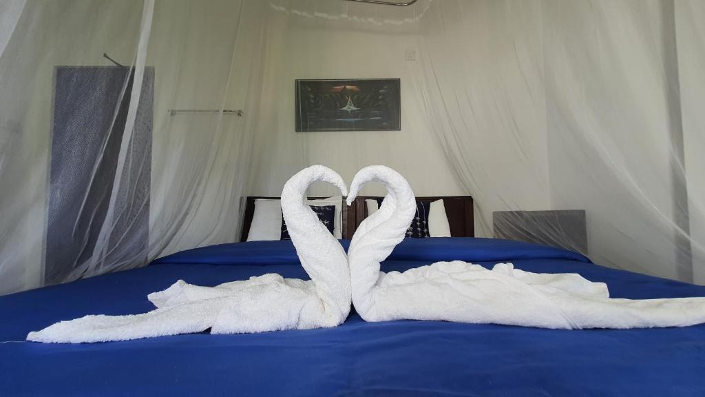 Postel nebo postele na pokoji v ubytování Villa Emerald Ella
