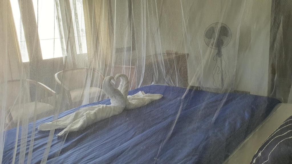 Postel nebo postele na pokoji v ubytování Villa Emerald Ella