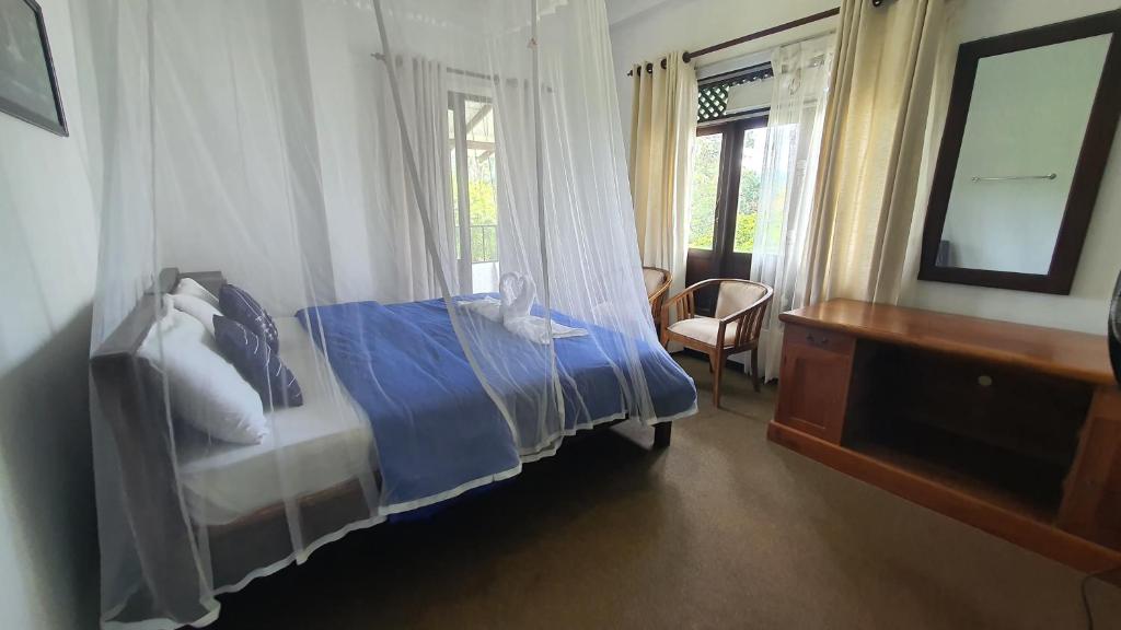Postel nebo postele na pokoji v ubytování Villa Emerald Ella