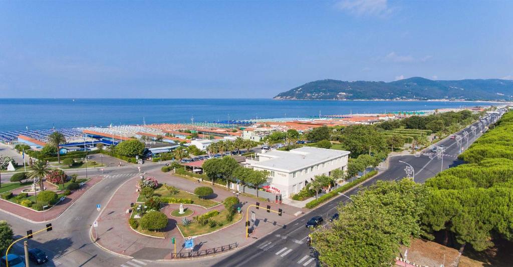 an aerial view of a city with the ocean at Hotel Tenda Rossa in Marina di Carrara