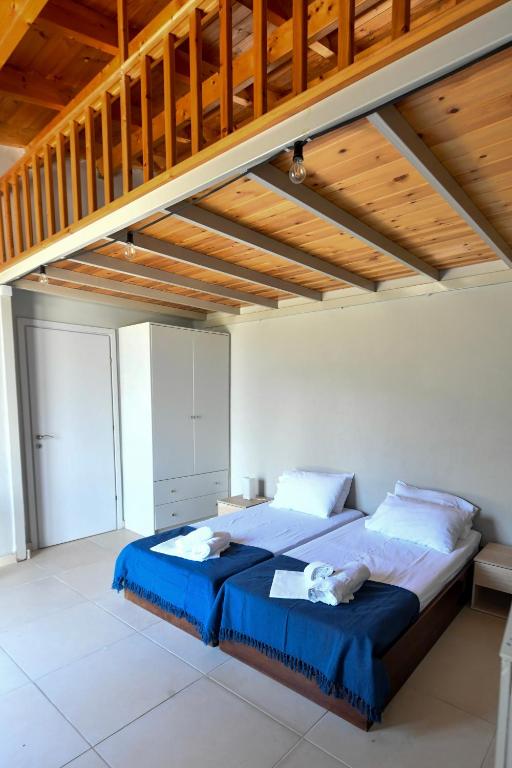 Posteľ alebo postele v izbe v ubytovaní Green 'n Gray Sea & Mountain House