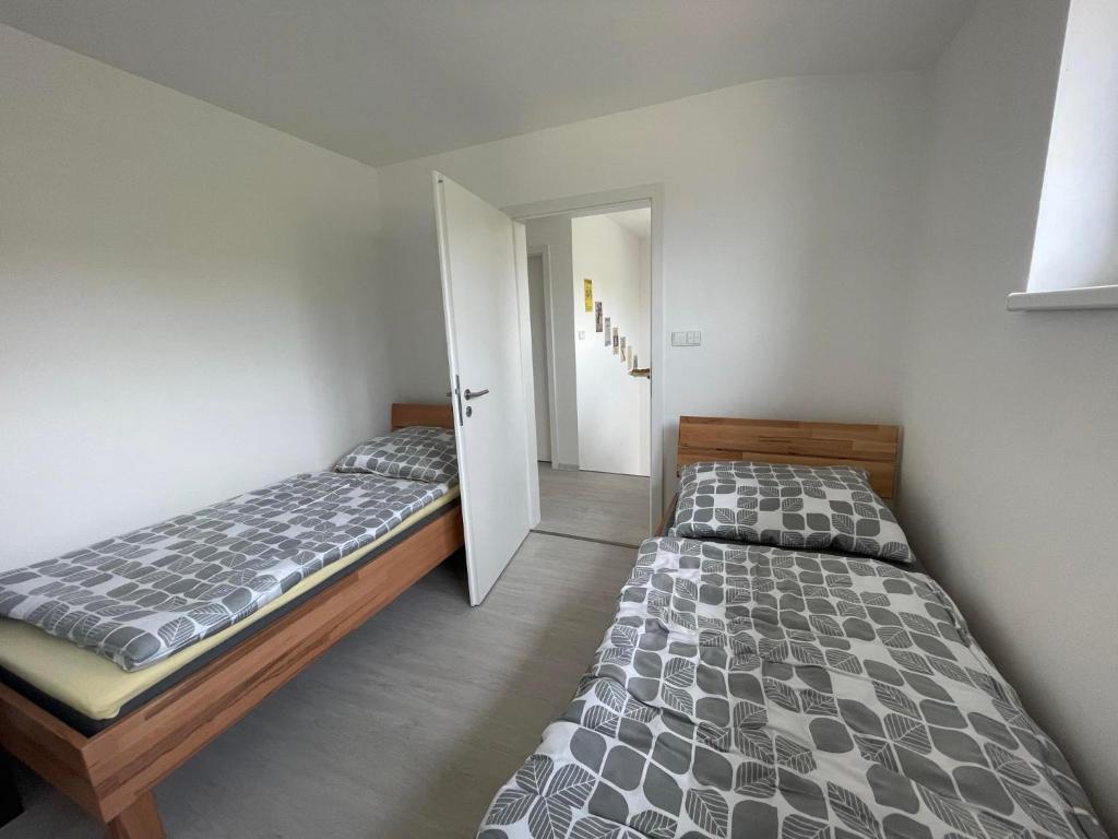 Postel nebo postele na pokoji v ubytování Apartmán Bystřice