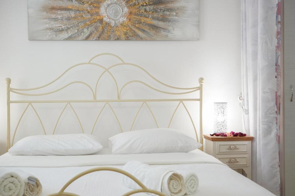 Postel nebo postele na pokoji v ubytování Avlemonas Guest House