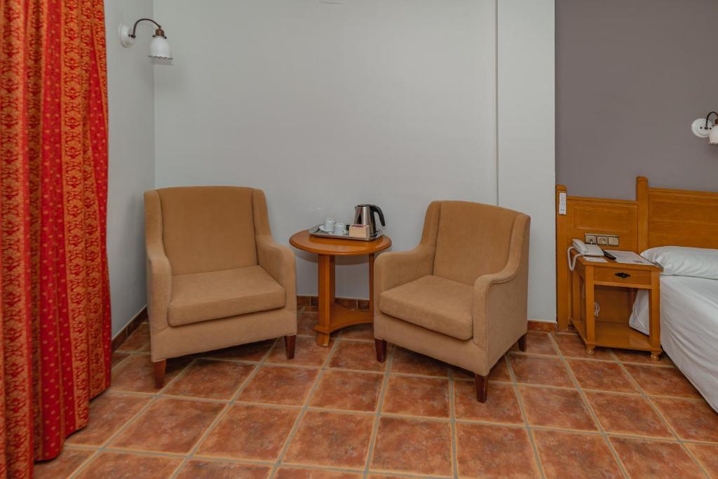 Postel nebo postele na pokoji v ubytování Hotel La Fragua II